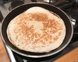 A picture of step 3 of Cheesy Black Bean Quesadillas.
