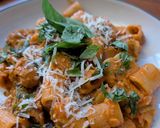 A picture of step 7 of Pasta alla vodka, with pork and sprouts.