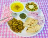 A picture of step 12 of Yellow Moong Dal,Karela,Onions Bhaji,Whole lentils salad,mint chutney,Chapatis.