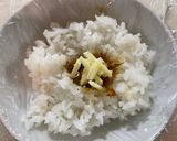 A picture of step 2 of Onigiri with bonito flakes and cheese.