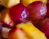 A picture of step 3 of Fruit Salad with Grapes 🍇 banana 🍌, apple 🍎, peach 🍑 & mango 🥭.