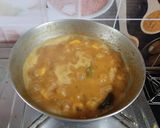 A picture of step 6 of Chingri Moong Daal.