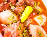 A picture of step 7 of Aloo Gosht.