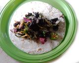 A picture of step 4 of Mexican Enchilada With black bean, cheese, black olives and etc. Stuffing.