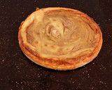 A picture of step 27 of White Layer Cake with a Raspberry Swirl Cheesecake center layer and a Raspberry Cream Frosting.