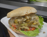Foto del paso 15 de la receta: Sándwich con muchos vegetales y pollo🥙🥯🧅🍆🍗🥪