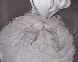 A picture of step 10 of Strawberry milk cake with whipped cream frosting.