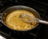 A picture of step 7 of Roast Pork Tenderloin with a Green Peppercorn Cream Sauce.