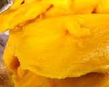A picture of step 1 of Swiss roll mangoes custard loaded with walnuts.
