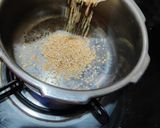 A picture of step 1 of Doodh daliya in pressure cooker (with different toppings).
