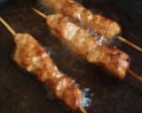 A picture of step 2 of Orange Chicken skewers.