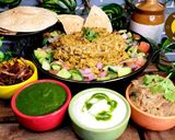 A picture of step 6 of Uttar Pradesh Urad Daal Aur Naye Chawal ki Khichdi Aloo Bharte Aur Hari Chutney (dinner or lunch).