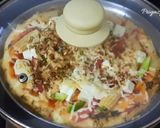 A picture of step 5 of Babycorn Pizza in Kadai.
