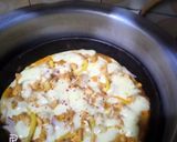 A picture of step 3 of Chicken Tikka pizza.