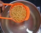 A picture of step 1 of Corn cheese pasta in peri peri white sauce.