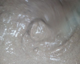 A picture of step 2 of Ragi mudda with mutton curry.