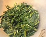 A picture of step 2 of Dandelion Ka Saag. with grape tomatoes and blue cheese.