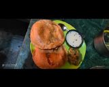 A picture of step 8 of Aligarh kachori with aloo sabji and raita.