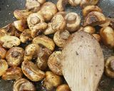 A picture of step 3 of Buttered Mushrooms in a little white wine and Balsamic Vinegar.