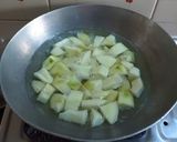 A picture of step 1 of Achari aam sabji.