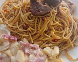 A picture of step 6 of Jollof spaghetti with beef and potato salad.