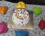 A picture of step 13 of Holi special Vanilla colourful cake.