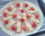 Foto del paso 5 de la receta: Hojaldre de jamón, emmental, queso de cabra y tomates cherry