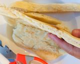 Hình bước làm 4 của món Ăn vặt: Bánh mì que nướng chảo chấm nước sốt cà chua hành tây