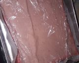 A picture of step 8 of Strawberry milk cake with whipped cream frosting.