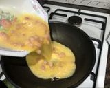 Foto del paso 5 de la receta Tortilla francesa rellena de bacon y queso