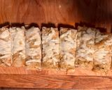 A picture of step 5 of The ABSOLUTE BEST Roasted Garlic Cheese Bread 🥖.