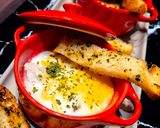 Une image de l'étape 4 de Œufs cocotte au poulet et au cheddar.