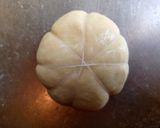 A picture of step 12 of Pumpkin shaped dinner rolls.