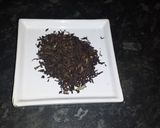 A picture of step 1 of Persian black tea with dried rose petals.
