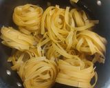 A picture of step 1 of Chicken fettuccine creamy pink pasta.