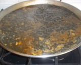 Foto del paso 6 de la receta: Paella de calamares en su tinta y sin verduras