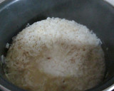 Foto del paso 10 de la receta: Arroz con salchichas en salsa y huevos fritos