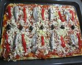 A picture of step 8 of Oregano Pizza with Sardines and Roasted Peppers.