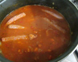 Foto del paso 5 de la receta: Arroz con salchichas en salsa y huevos fritos