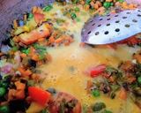 A picture of step 7 of Egg Bhuji with veggies.