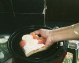 A picture of step 2 of Air Fryer Egg Bread Pizza.