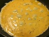 Tortilla francesa con bacon y queso en polvo