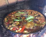 A picture of step 9 of Paella with Vegetables and Meat.
