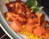 A picture of step 6 of Tomato & Mustard Sticky Chicken with Sweet Potato Fries & Veg.