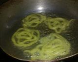 A picture of step 7 of Jalebi with hot milk.
