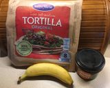A picture of step 1 of Banana peanut butter tortilla.