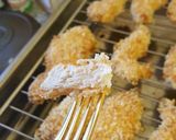 A picture of step 8 of Parmesan and Panko Baked Chicken Tenders.