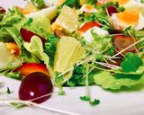 A picture of step 2 of Boiled Egg Baby Greens and Fruit Salad.