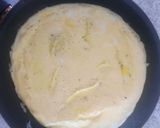 A picture of step 2 of Egg pizza on a pan.