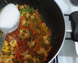 A picture of step 3 of Tom yum shrimp rice.